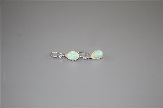 A pair of white metal, pear shaped white opal and diamond set drop earrings, opals approx. 12mm, gross weight 2.7 grams.